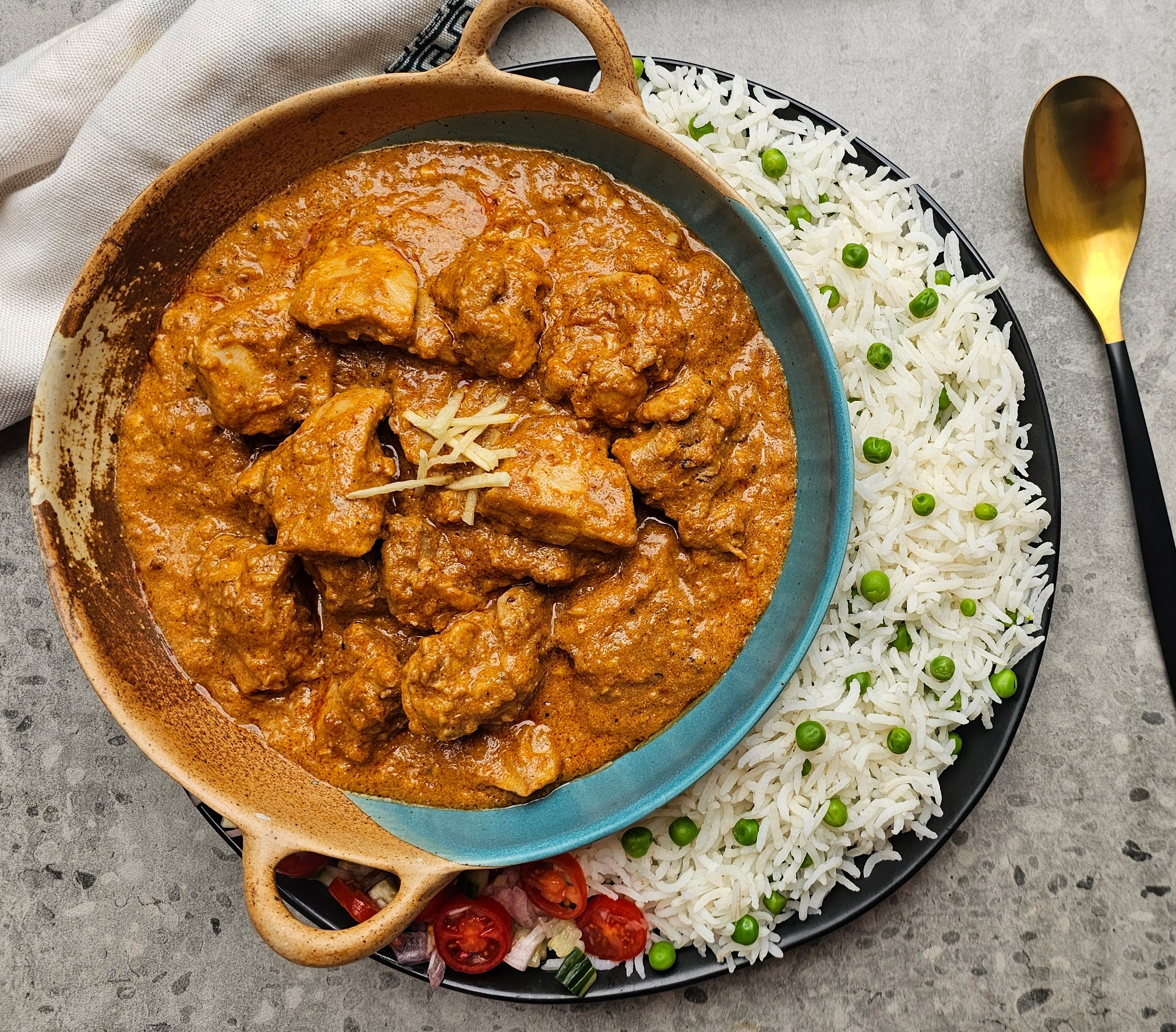 Chicken curry with pea rice and gold spoon