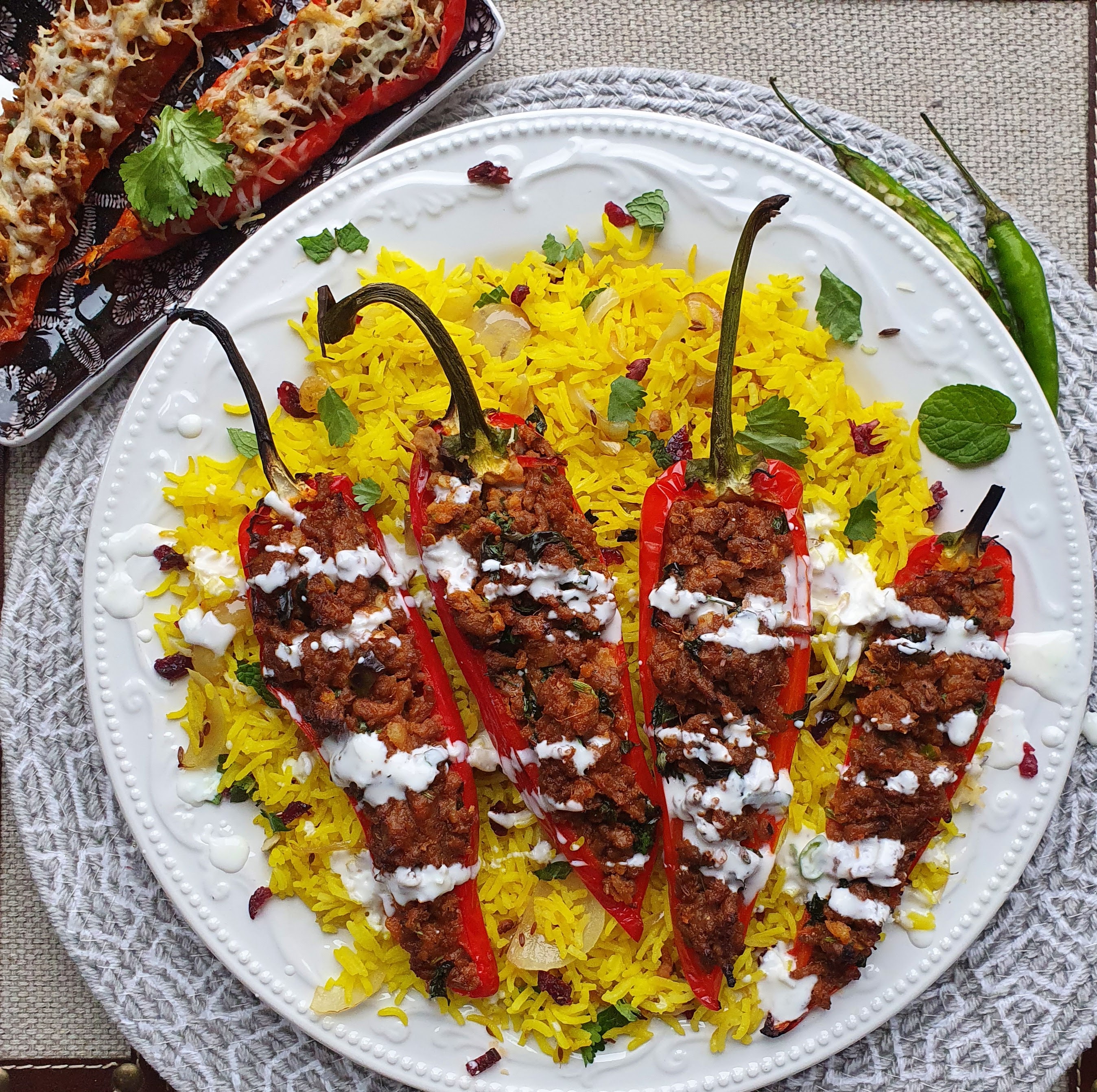 Stuffed red peppers with keema on saffron rice